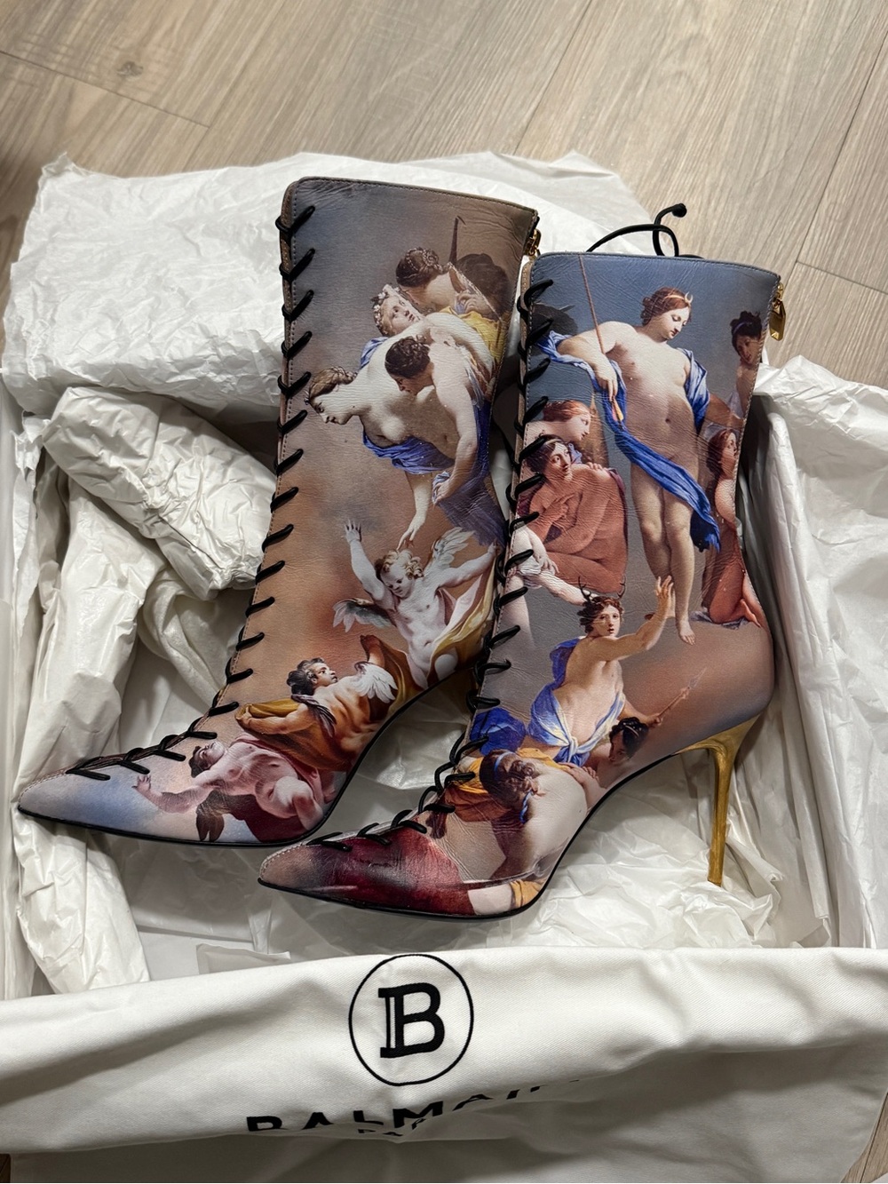 BALMAIN
Ankle Boots
Uria Sky Lace-Up Stiletto. Artistic print leather boots